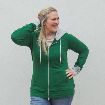 Jennifer Full Zip Video, forest green with grey accent hood and thumbholes, shown in size large, hourglass shape - Shop7degrees